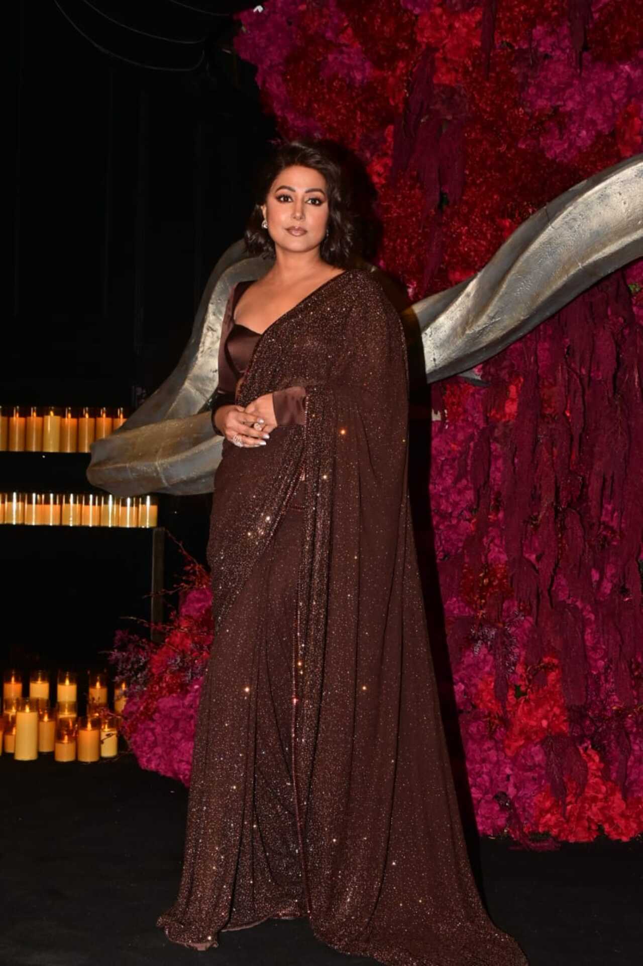 Hina Khan was also seen arriving for Nupur and Stebin's reception dressed in a dark brown saree.